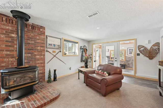 a spacious bedroom with a bed and a furniture