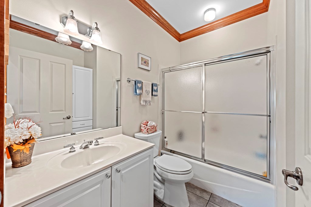 726 Paradise Ranch Road Fredericksburg, TX 78624 - Photo 19 of 38 a bathroom with a sink toilet and shower
