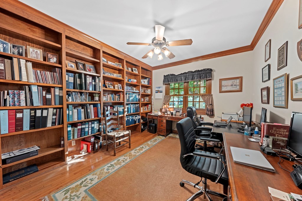726 Paradise Ranch Road Fredericksburg, TX 78624 - Photo 21 of 38 a living room with furniture a bookshelf and a window