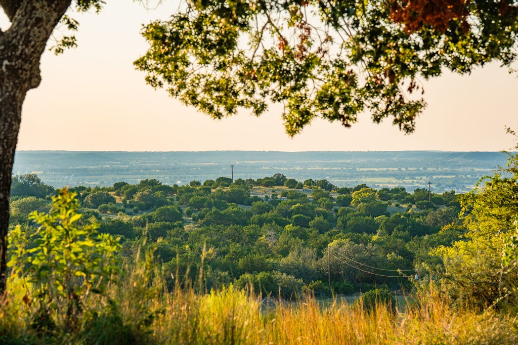726 Paradise Ranch Road Fredericksburg, TX 78624 - Photo 33 of 38 a view of a lake with a mountain