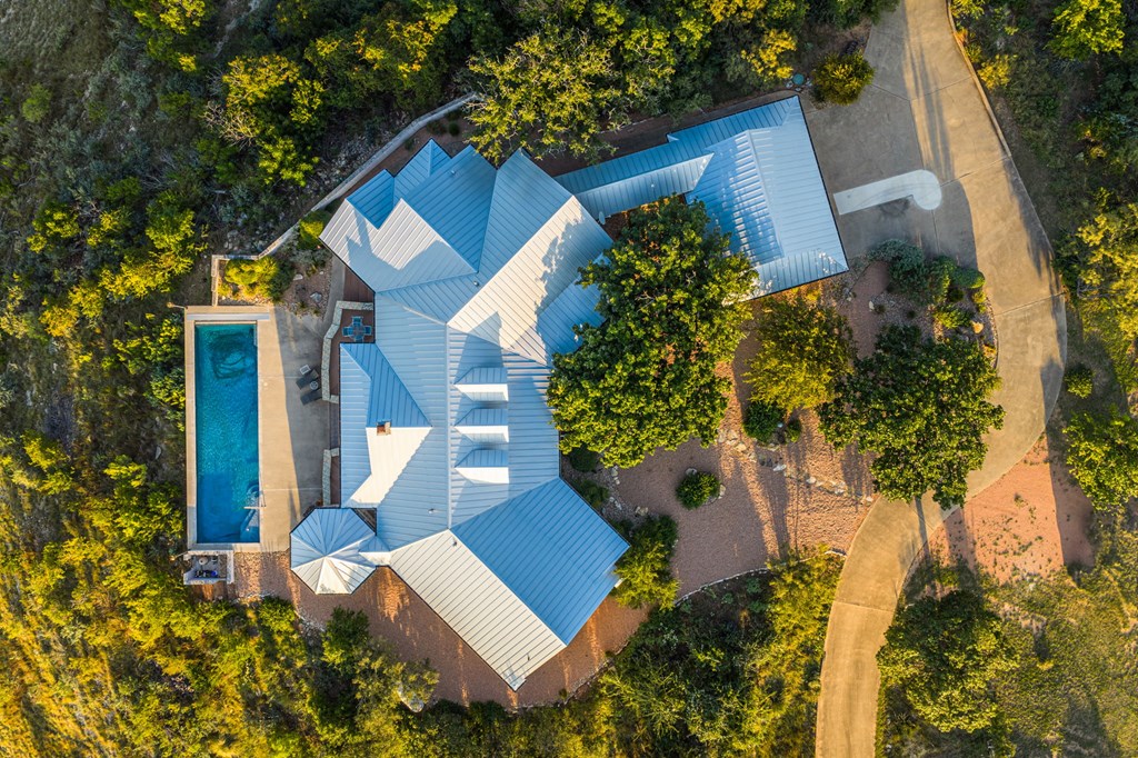 726 Paradise Ranch Road Fredericksburg, TX 78624 - Photo 4 of 38 a view of a house with a yard and garden