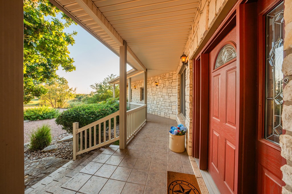 726 Paradise Ranch Road Fredericksburg, TX 78624 - Photo 6 of 38 a view of a two chairs in the balcony