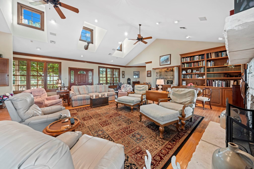 726 Paradise Ranch Road Fredericksburg, TX 78624 - Photo 7 of 38 a living room with furniture and a book shelf