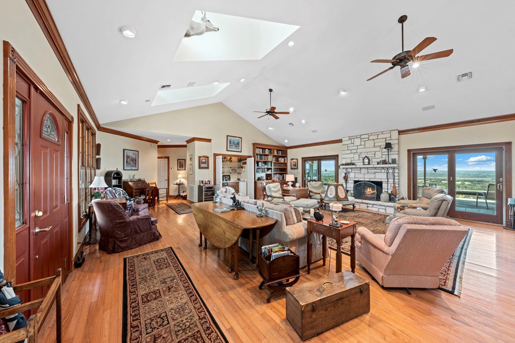 726 Paradise Ranch Road Fredericksburg, TX 78624 - Photo 8 of 38 a living room with furniture kitchen view and a large window