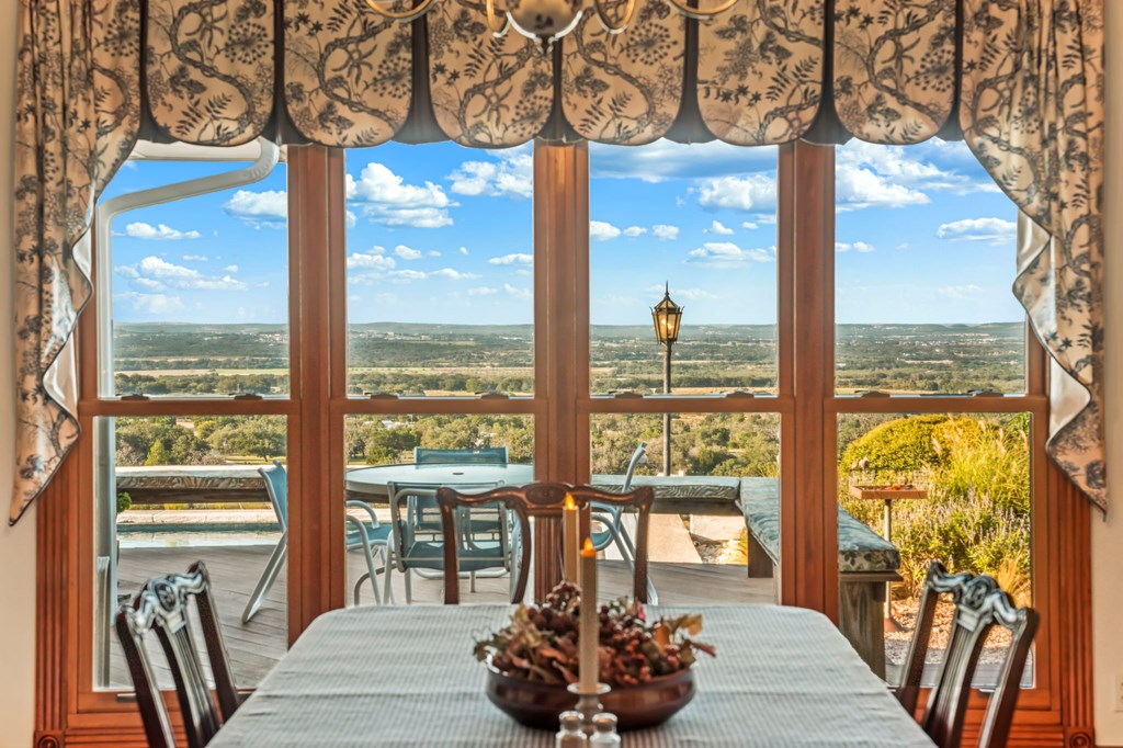 726 Paradise Ranch Road Fredericksburg, TX 78624 - Photo 10 of 38 a living room with furniture and floor to ceiling windows