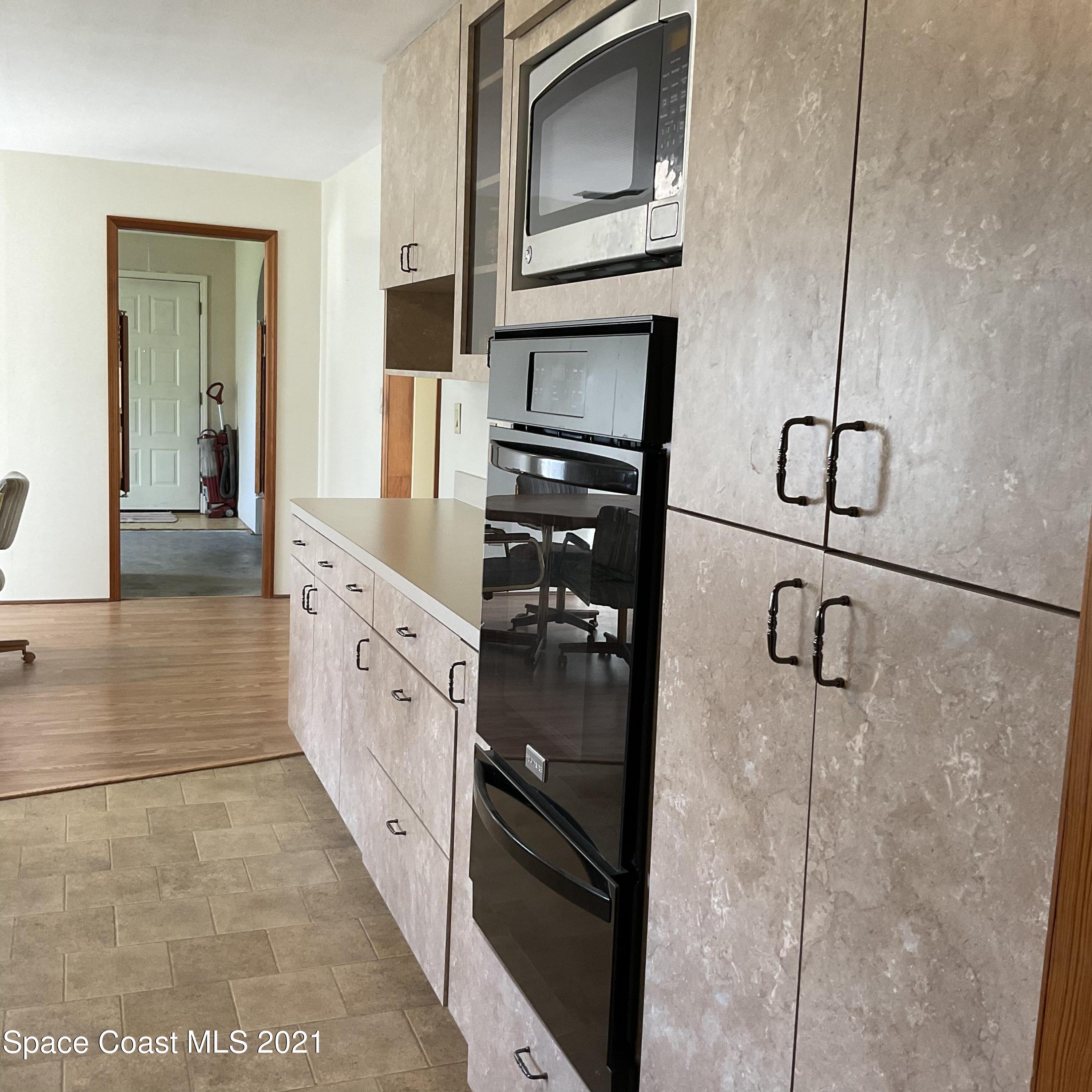 2580 Tammy Drive Mims, FL 32754 - Photo 19 of 47 a bathroom with granite countertop a sink and a mirror
