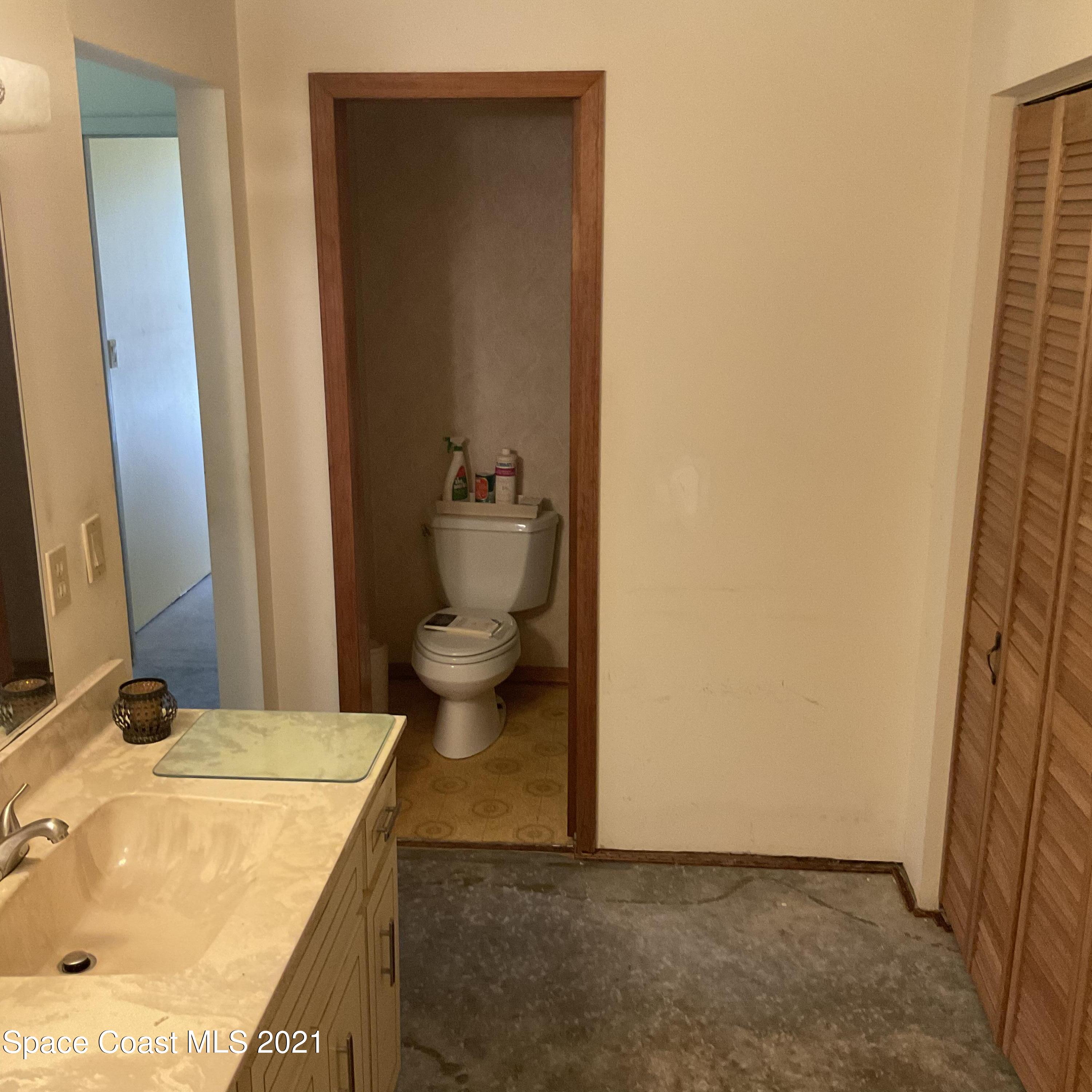 2580 Tammy Drive Mims, FL 32754 - Photo 28 of 47 a bathroom with a sink and a toilet