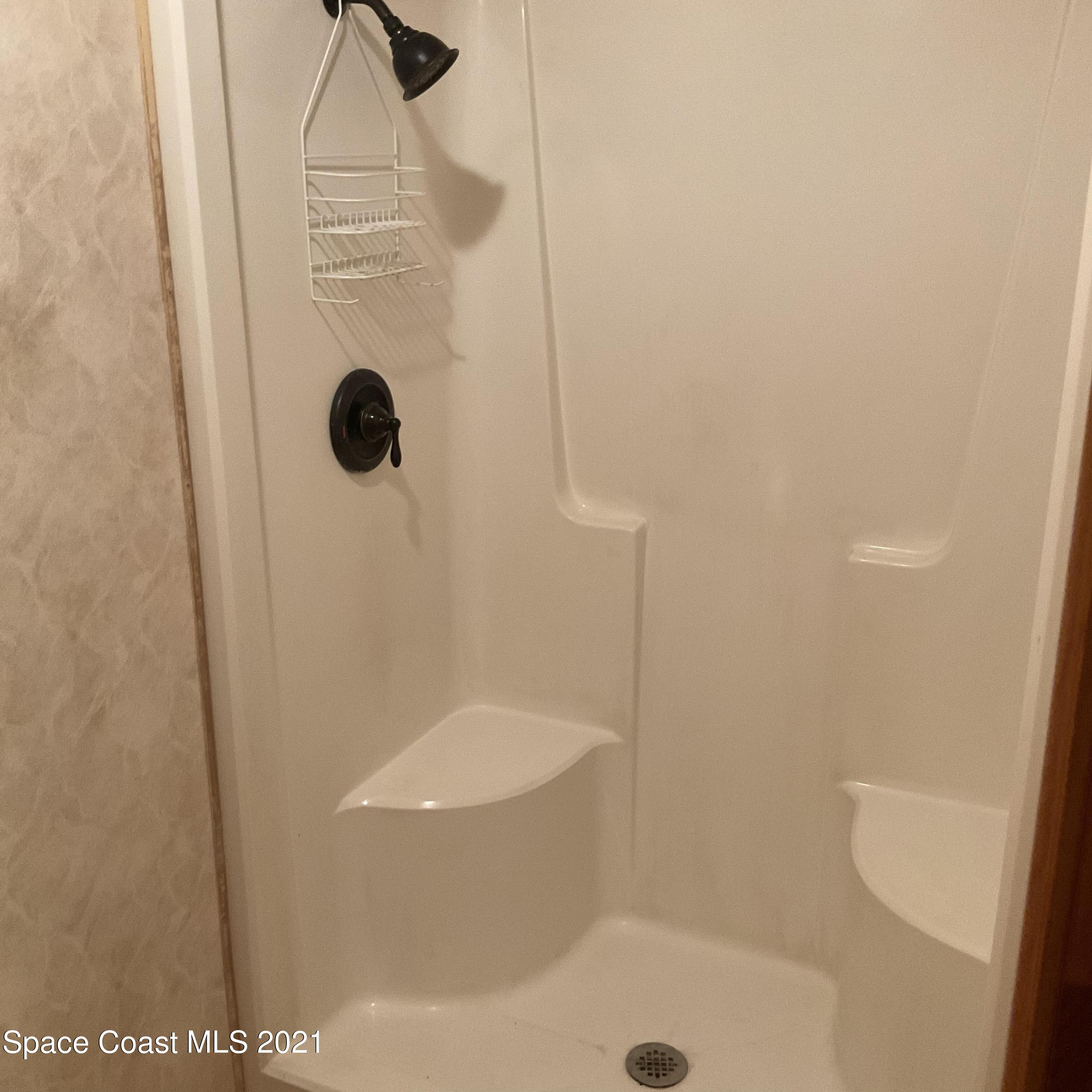 2580 Tammy Drive Mims, FL 32754 - Photo 29 of 47 a bathroom with a shower