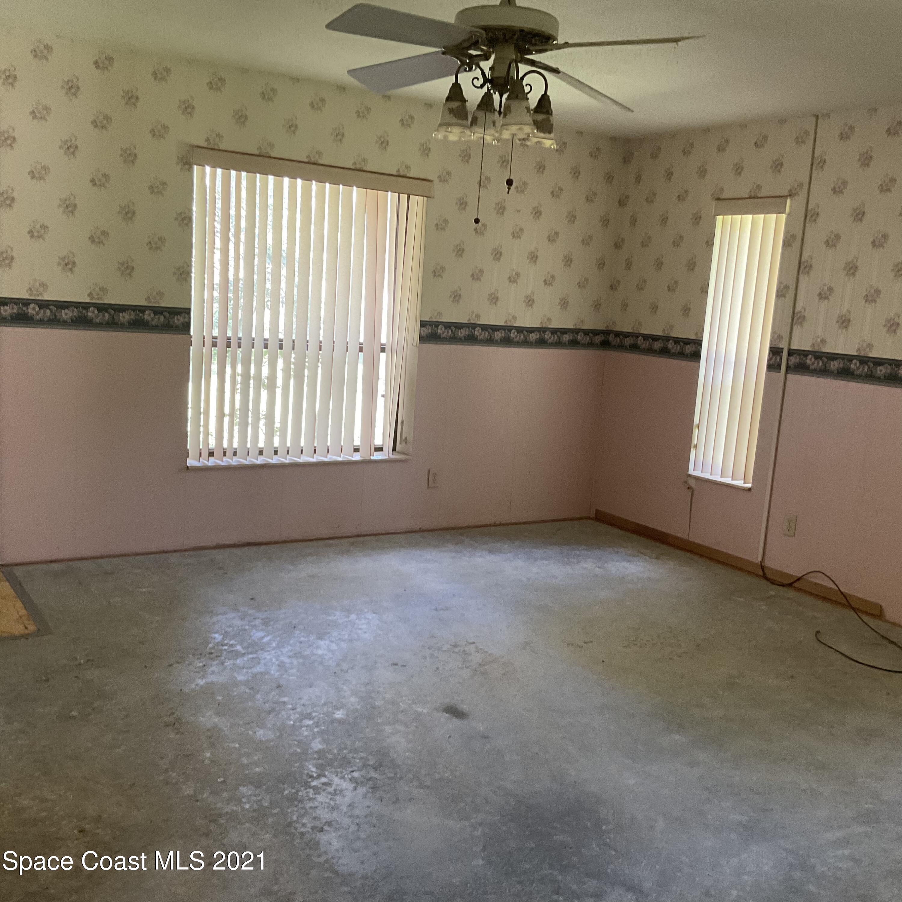 2580 Tammy Drive Mims, FL 32754 - Photo 30 of 47 an empty room with windows