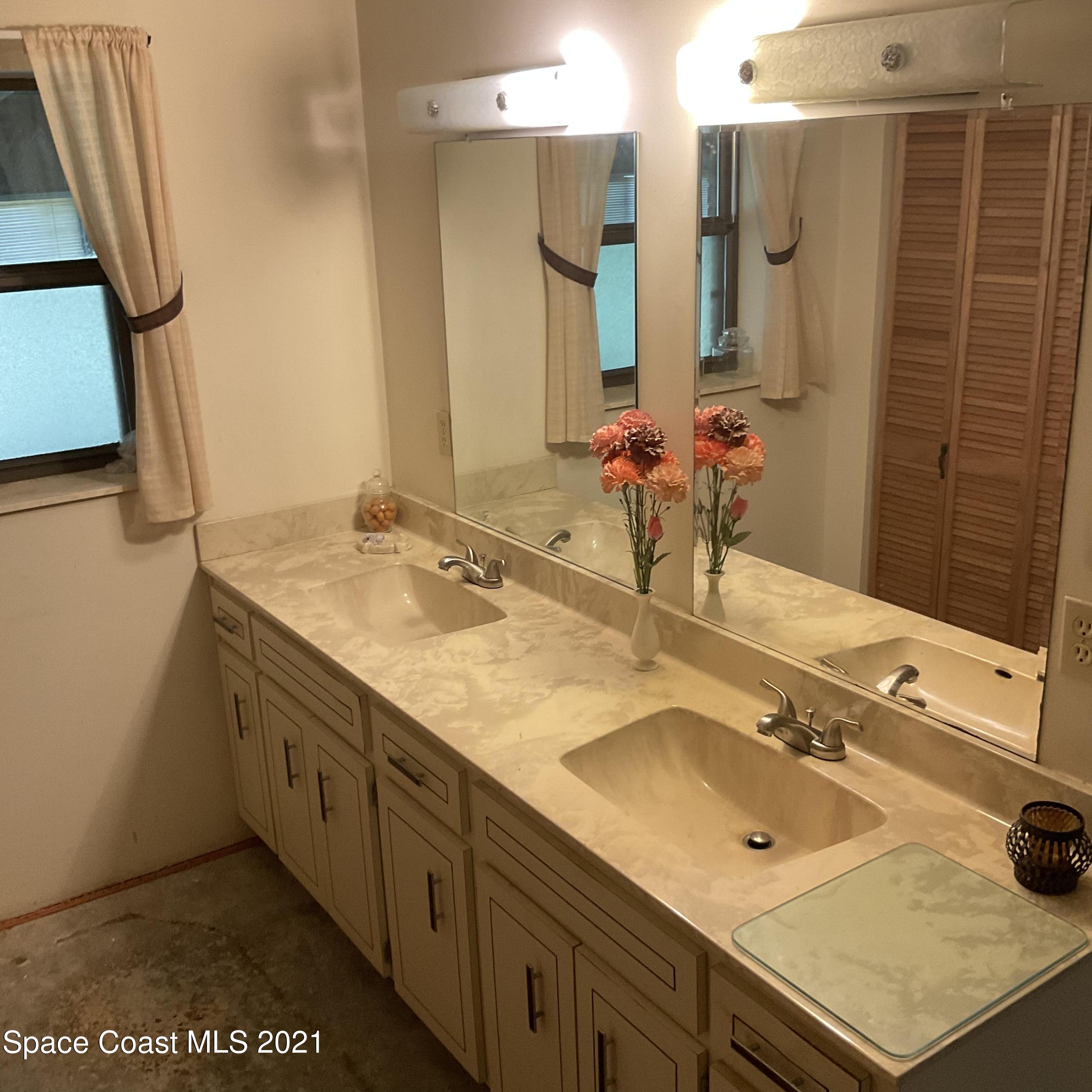 2580 Tammy Drive Mims, FL 32754 - Photo 31 of 47 a bathroom with a tub sink and mirror