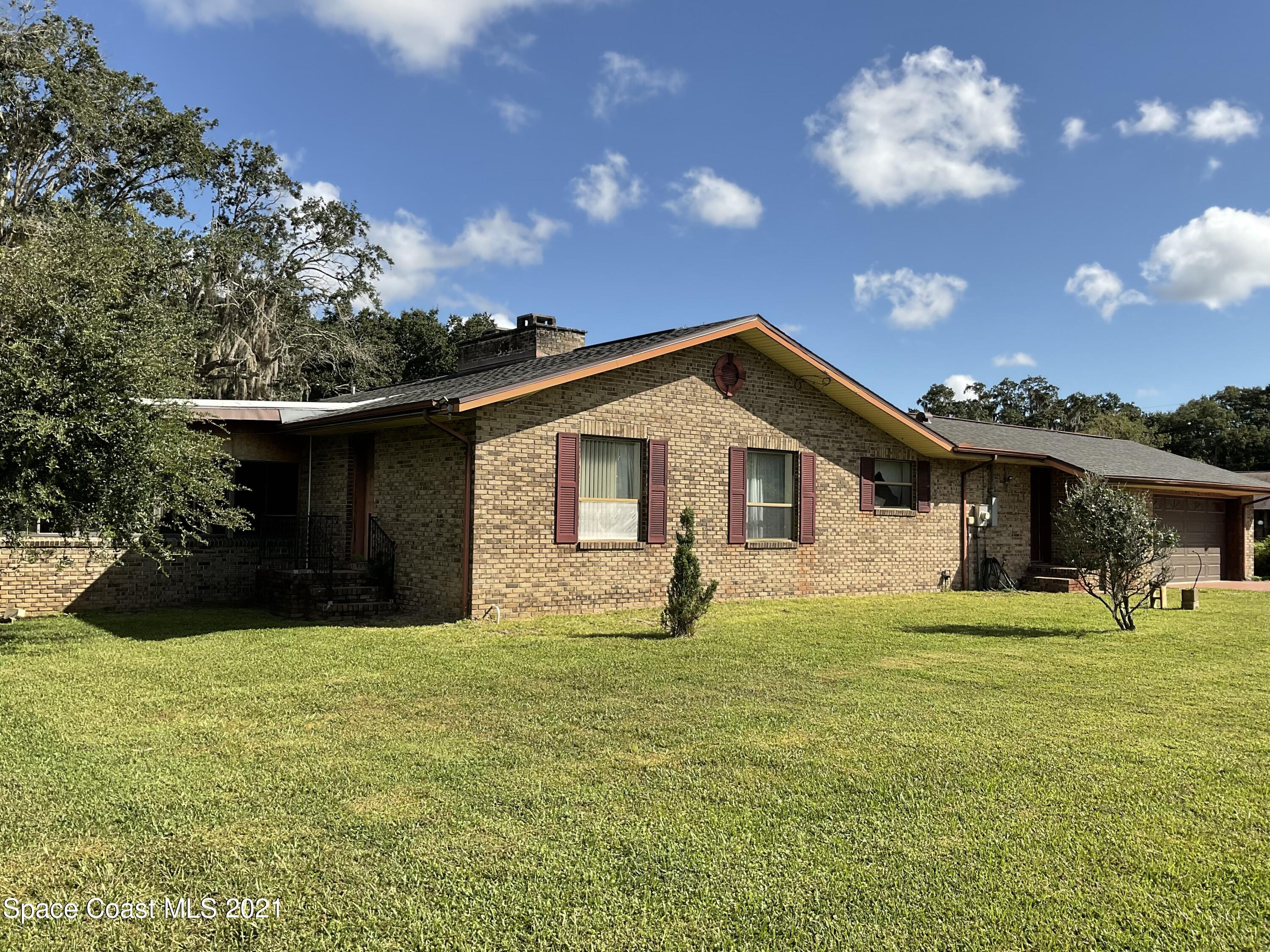 2580 Tammy Drive Mims, FL 32754 - Photo 40 of 47 a front view of a house with a yard