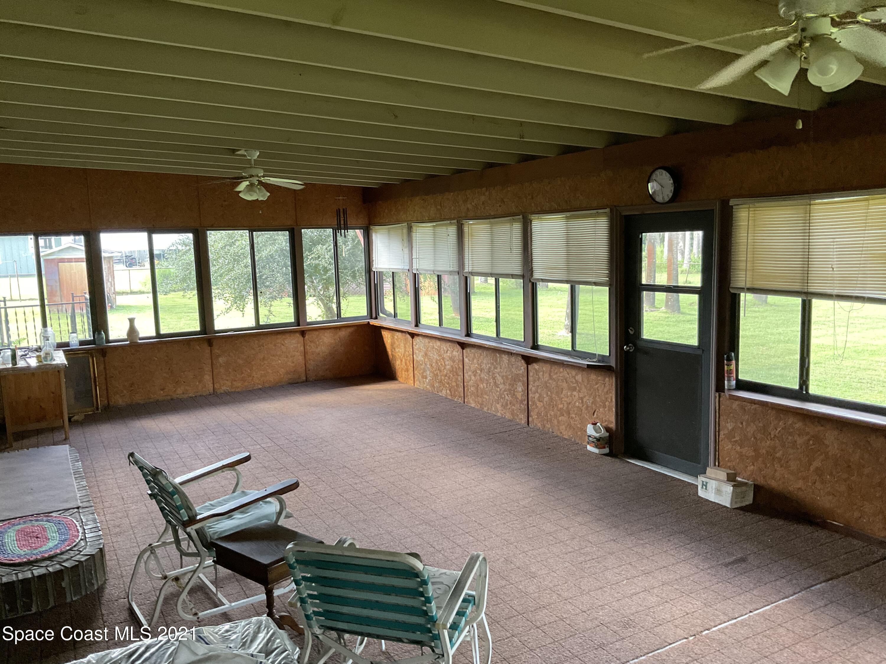 2580 Tammy Drive Mims, FL 32754 - Photo 10 of 47 a living room with furniture and a large window