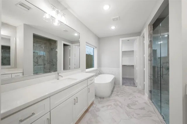 a bathroom with a sink and a large mirror