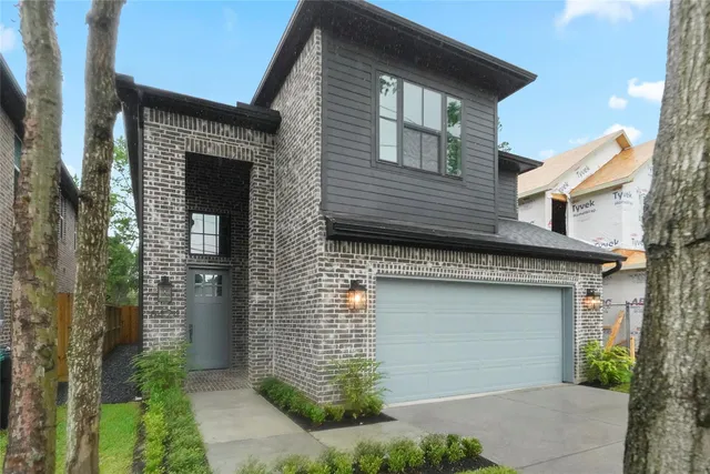 a front view of a house with garage