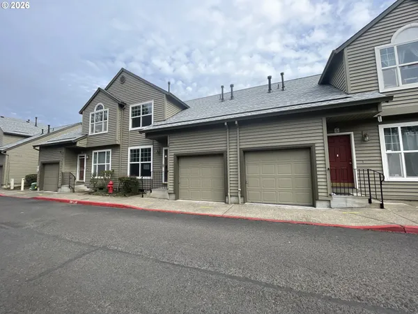 a front view of a house with yard