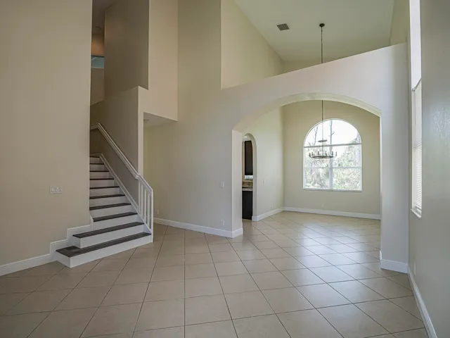 a kitchen with stainless steel appliances granite countertop a refrigerator stove a sink and dishwasher