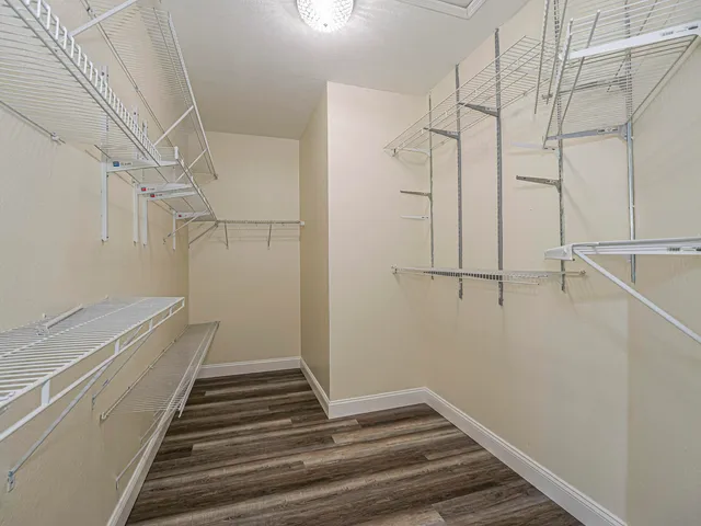 a bathroom with bathtub and window