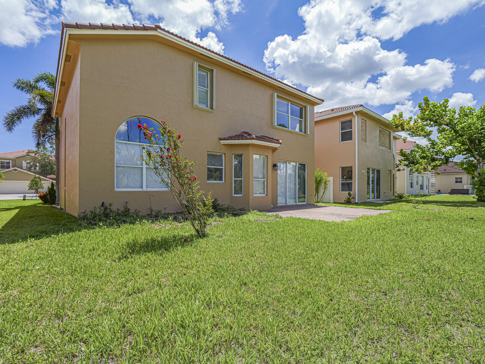 5605 Spanish River Road Fort Pierce, FL 34951 - Photo 39 of 40 a front view of house with yard and green space