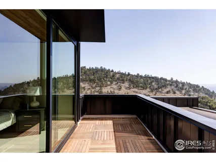 a view of balcony with furniture