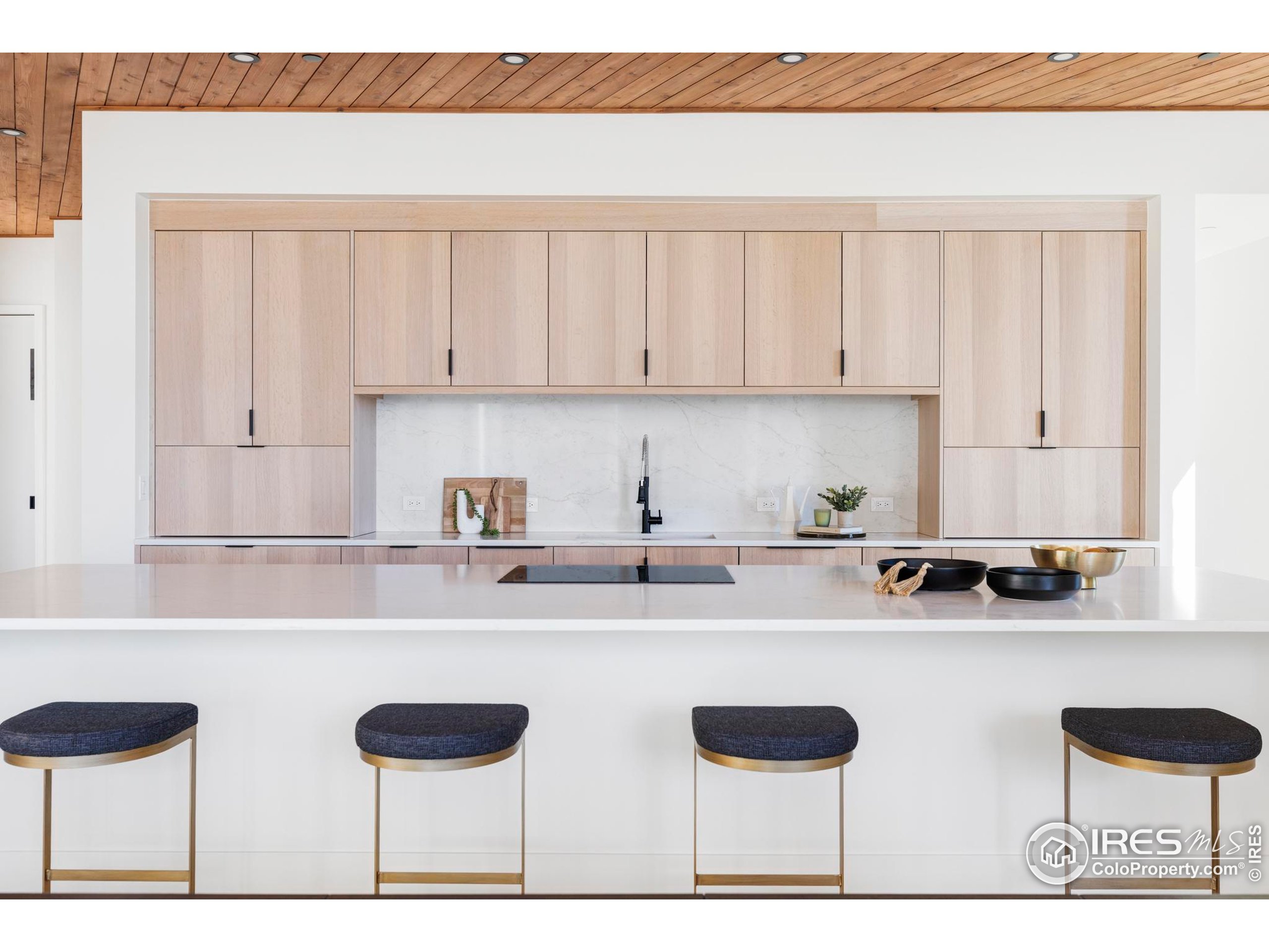 1575 Linden Drive Boulder, CO 80304 - Photo 18 of 39 a kitchen with a table chairs stove and cabinets