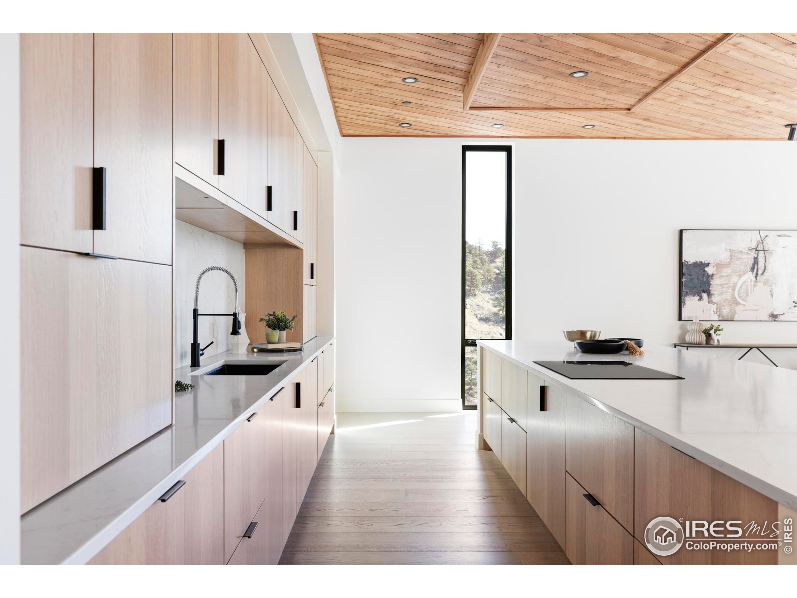 1575 Linden Drive Boulder, CO 80304 - Photo 22 of 39 a kitchen with stainless steel appliances a sink a stove and white cabinets