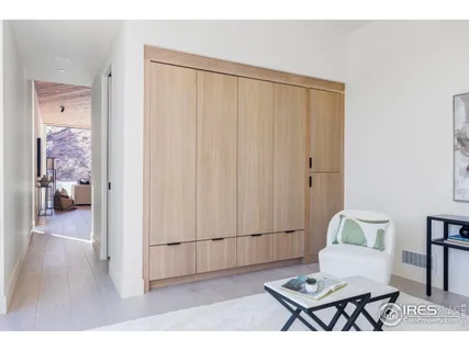 a living room with a table and a window