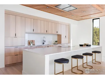 a kitchen with a sink cabinets and window