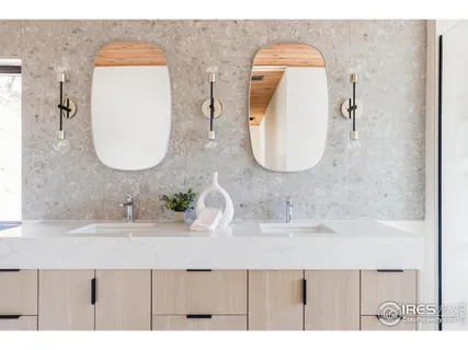 a bathroom with a sink vanity and a mirror