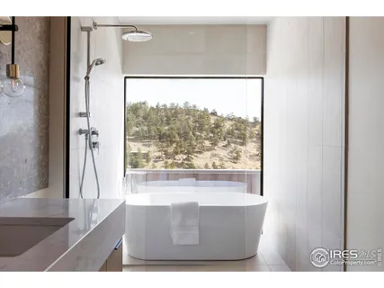 a living room with a large window and a table