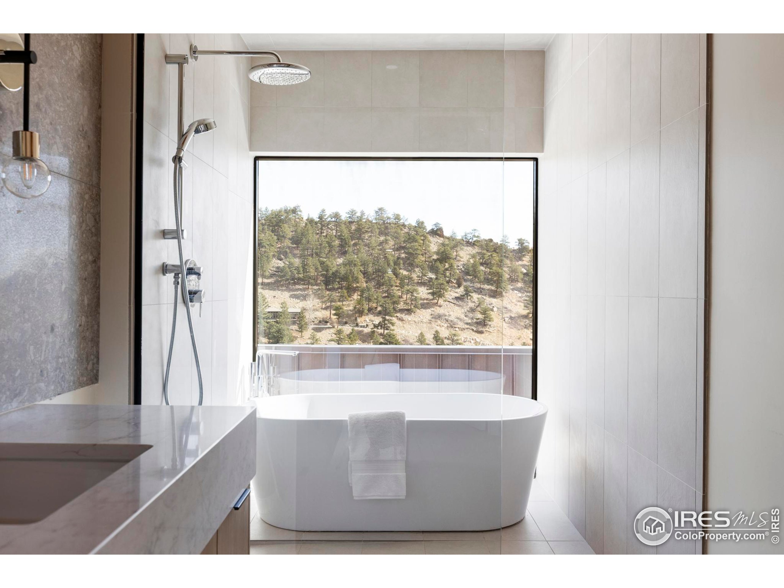 1575 Linden Drive Boulder, CO 80304 - Photo 10 of 39 a living room with a large window and a table