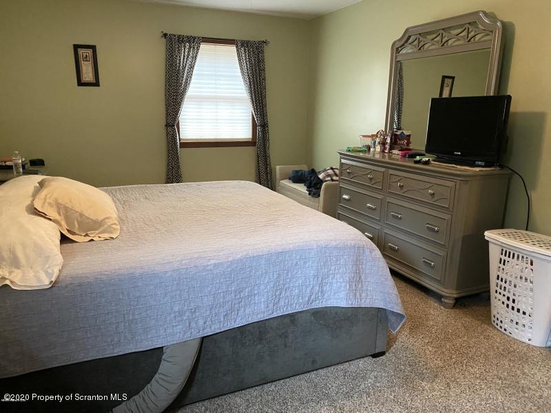 309 Church Road Mountain Top, PA 18707 - Photo 14 of 48 a bedroom with a bed and window