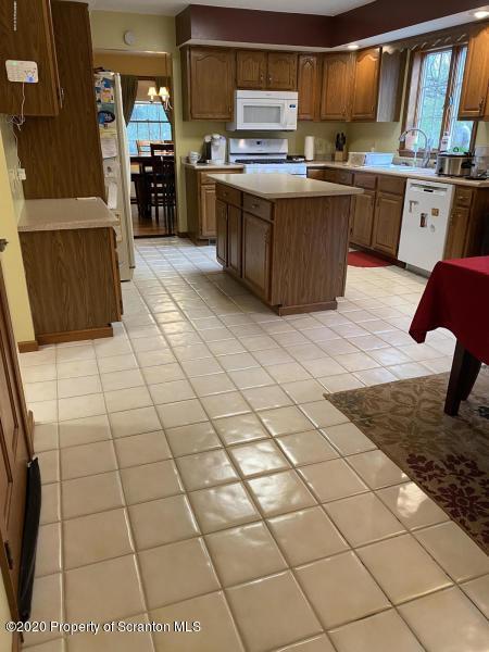 309 Church Road Mountain Top, PA 18707 - Photo 4 of 48 a kitchen with stainless steel appliances cabinets and wooden floor