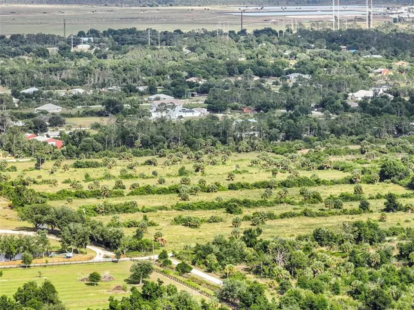 a view of a town with mountains in the background