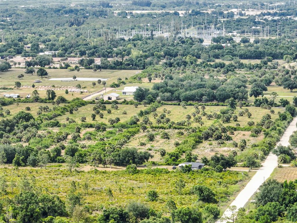 6227 Grove Boulevard Punta Gorda, FL 33982 - Photo 5 of 8 a view of a town with mountains in the background