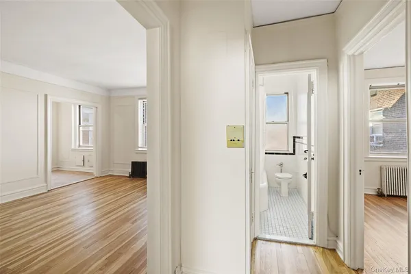 a view of a room with wooden floor