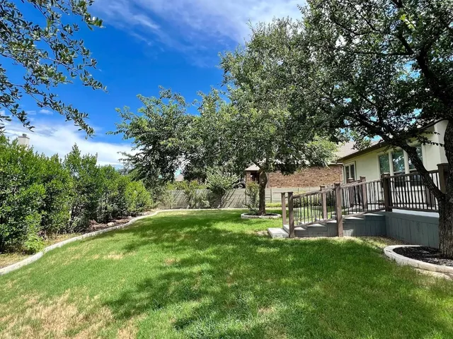 a view of a house with a yard porch and sitting area
