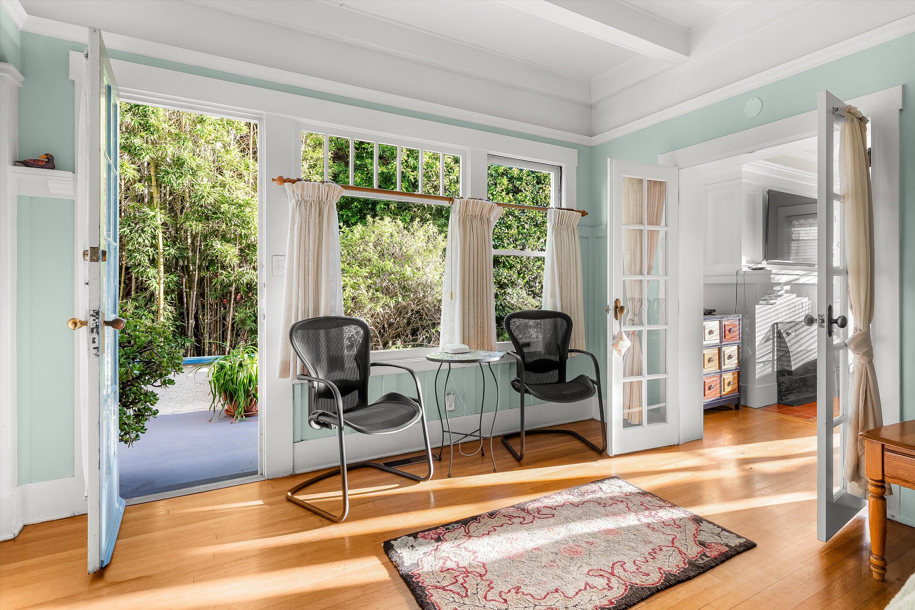 118 Chapala Street Santa Barbara, CA 93101 - Photo 17 of 46 a living room with furniture and a floor to ceiling window