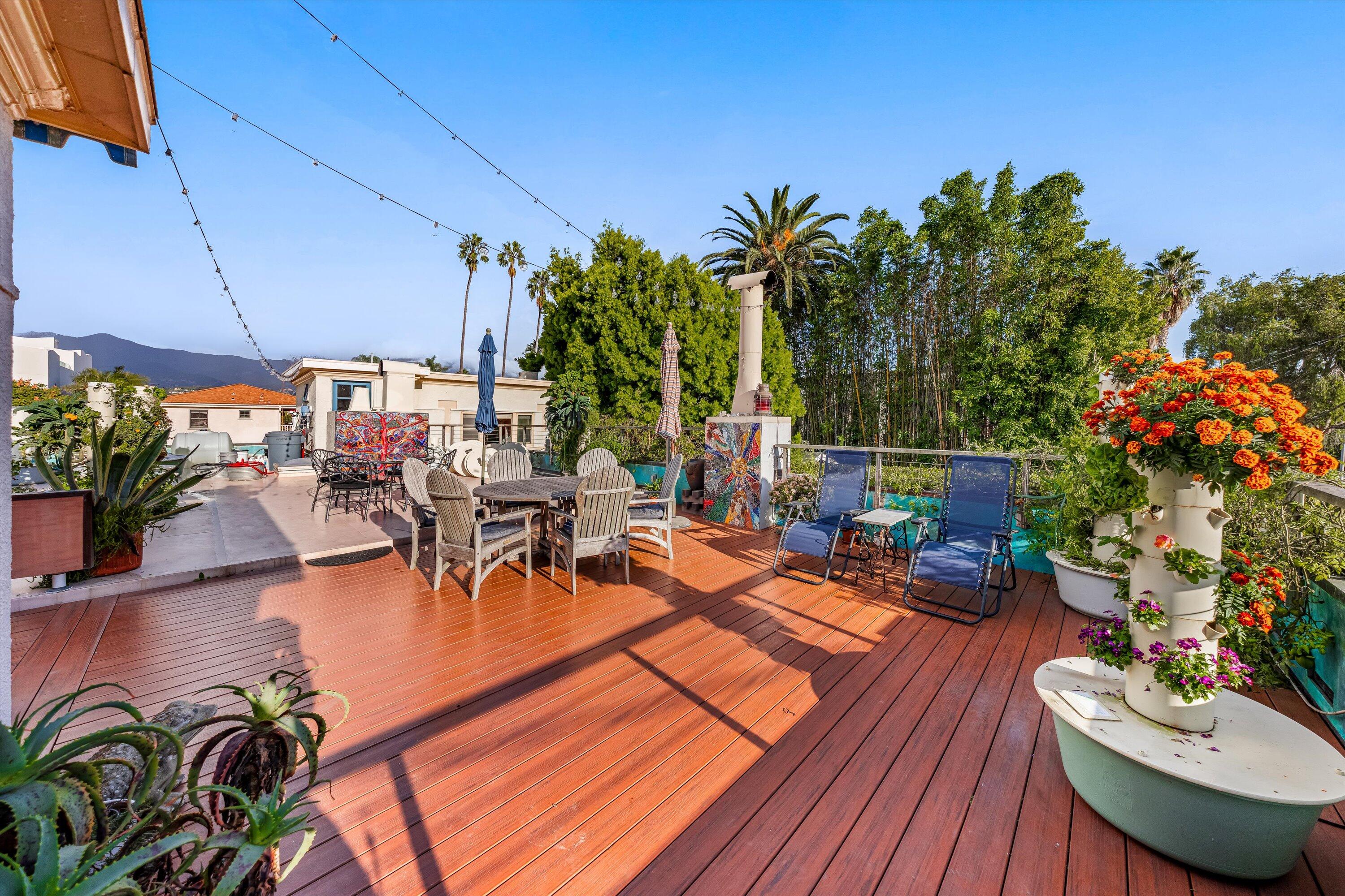 118 Chapala Street Santa Barbara, CA 93101 - Photo 7 of 46 a view of a swimming pool with chairs and table in patio