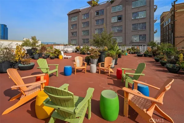 a view of a chairs and table in a patio