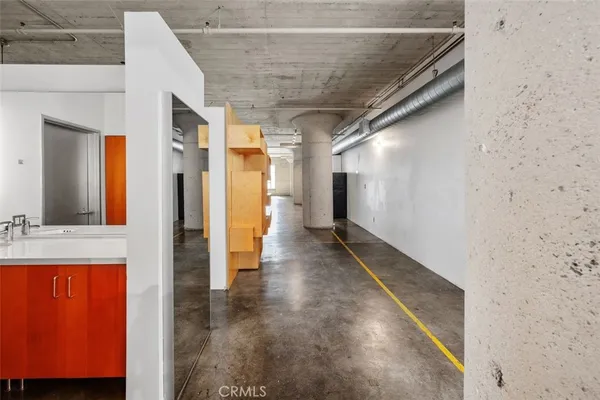 a view of a hallway with a kitchen