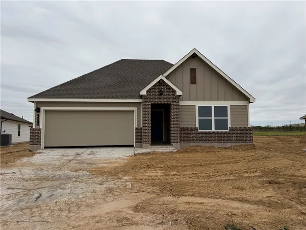 a front view of a house with yard