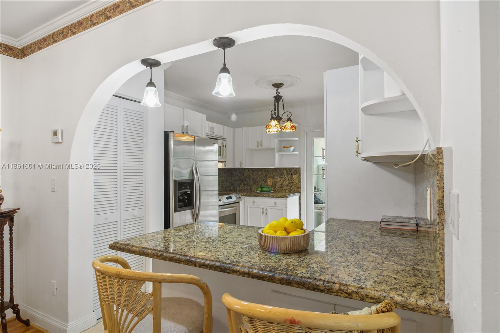 6101 Southwest 13th Terrace West Miami, FL 33144 - Photo 13 of 47 a bathroom with a granite countertop sink and a mirror