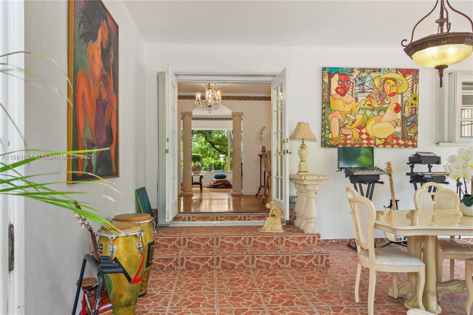 6101 Southwest 13th Terrace West Miami, FL 33144 - Photo 17 of 47 a living room with furniture and a painting on the wall