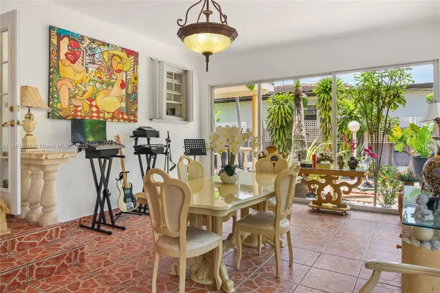 a view of a dining room with furniture window and outside view
