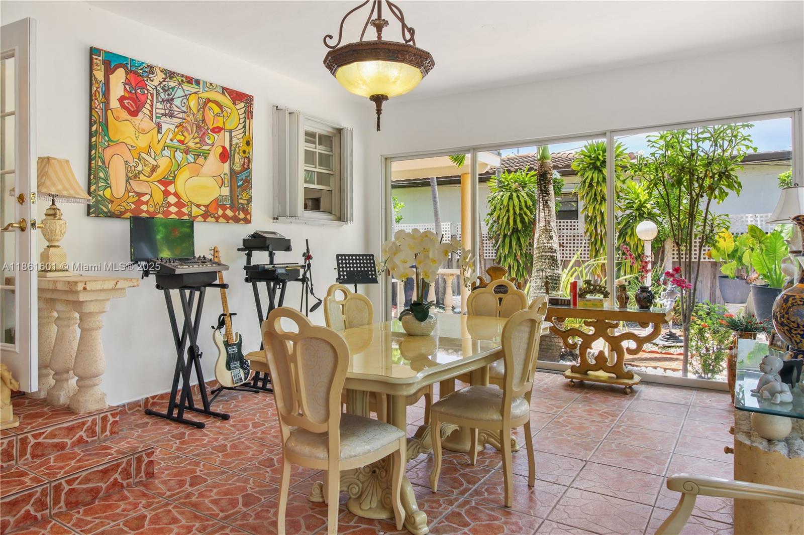 6101 Southwest 13th Terrace West Miami, FL 33144 - Photo 20 of 47 a view of a dining room with furniture window and outside view