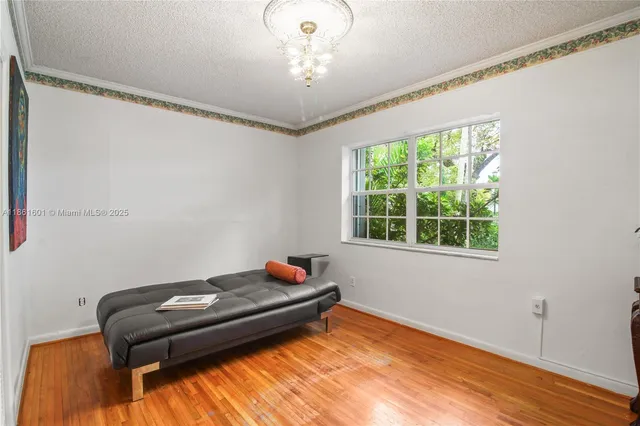 a bed room with a bed and a window