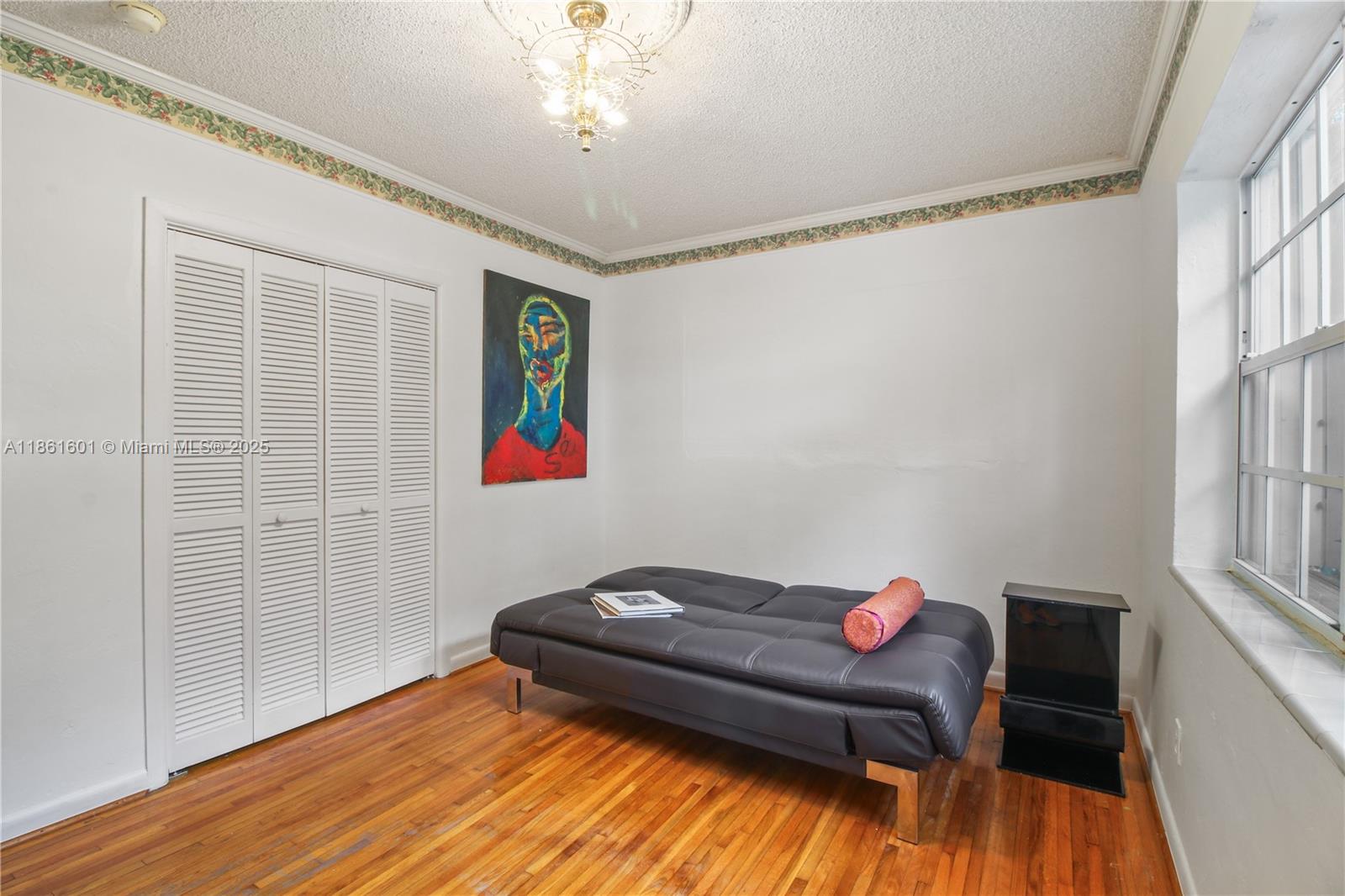 6101 Southwest 13th Terrace West Miami, FL 33144 - Photo 23 of 47 a living room with furniture and a wooden floor