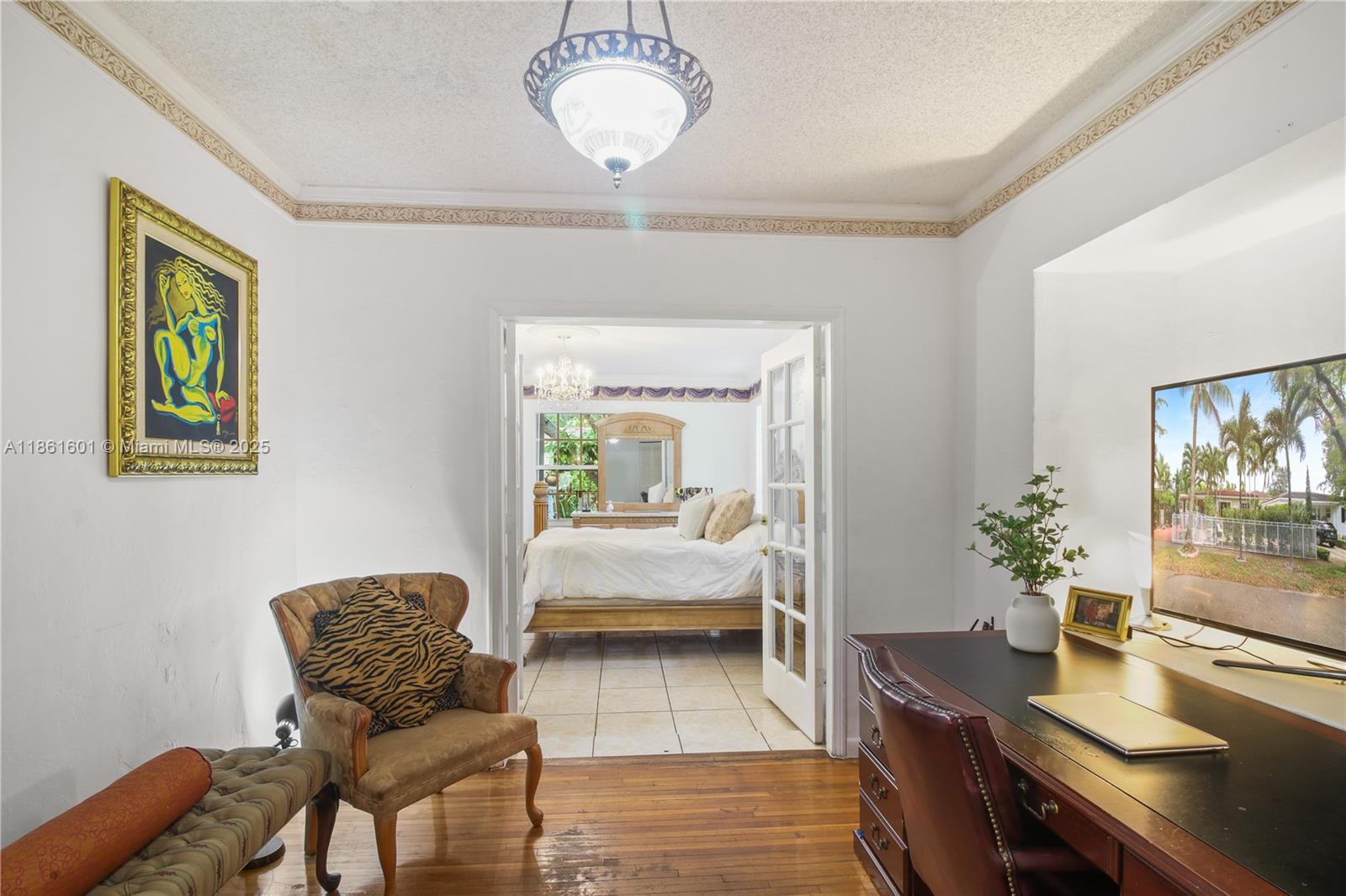 6101 Southwest 13th Terrace West Miami, FL 33144 - Photo 26 of 47 a bedroom with furniture and a bed