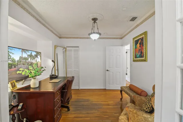 a bedroom with furniture and a window