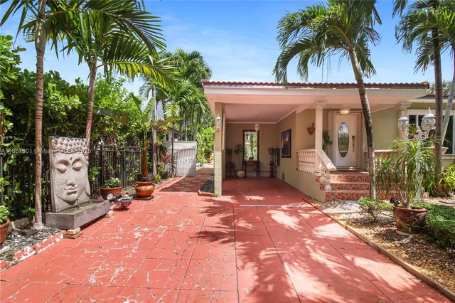 a view of a park with palm trees
